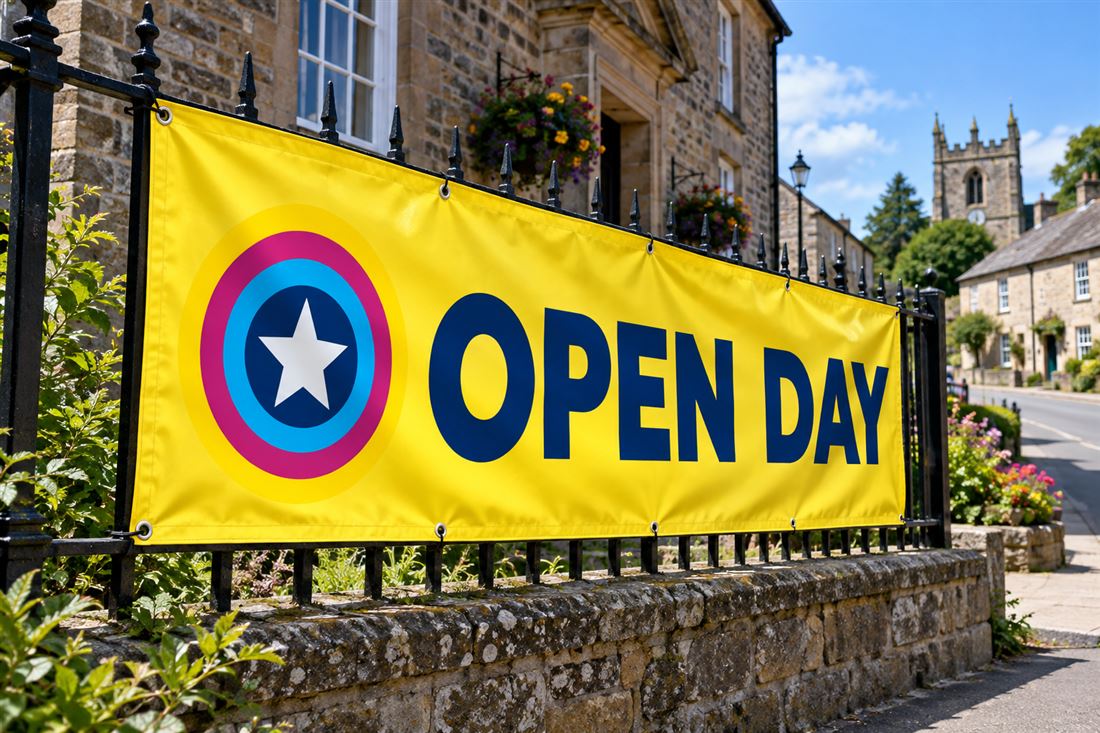 Yellow PVC banner tied to iron railings