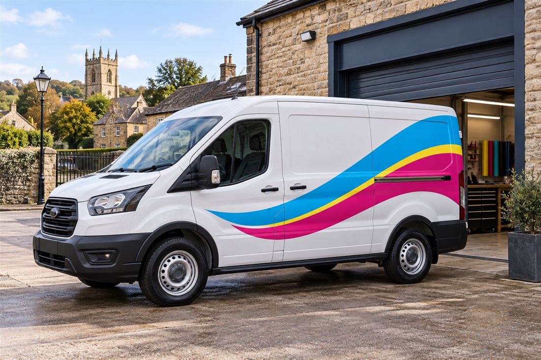 White panel van with cyan, magenta and yellow printed side graphics